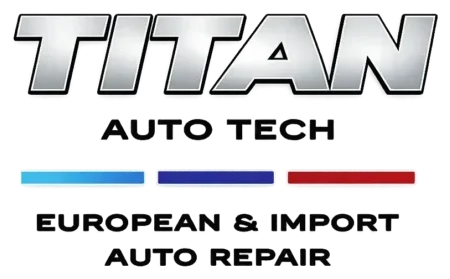 Logo for Titan Auto Tech with bold silver text, three horizontal lines in blue, purple, and red, and the words European & Import Auto Repair in black capital letters underneath.